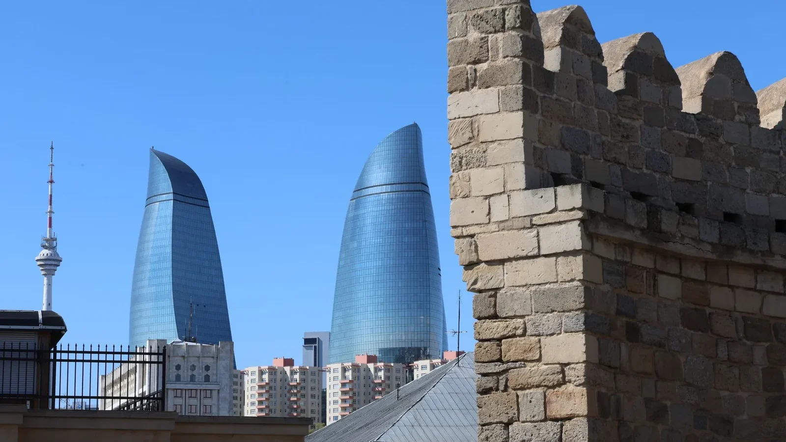 Baku Flame Towers rising behind the Old City walls, the first sight for many visitors arriving in Azerbaijan on an e-visa