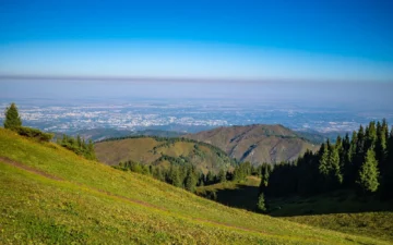 Almaty skyline and Tian Shan mountains, a main entry point for travellers from Kazakhstan visa-free countries