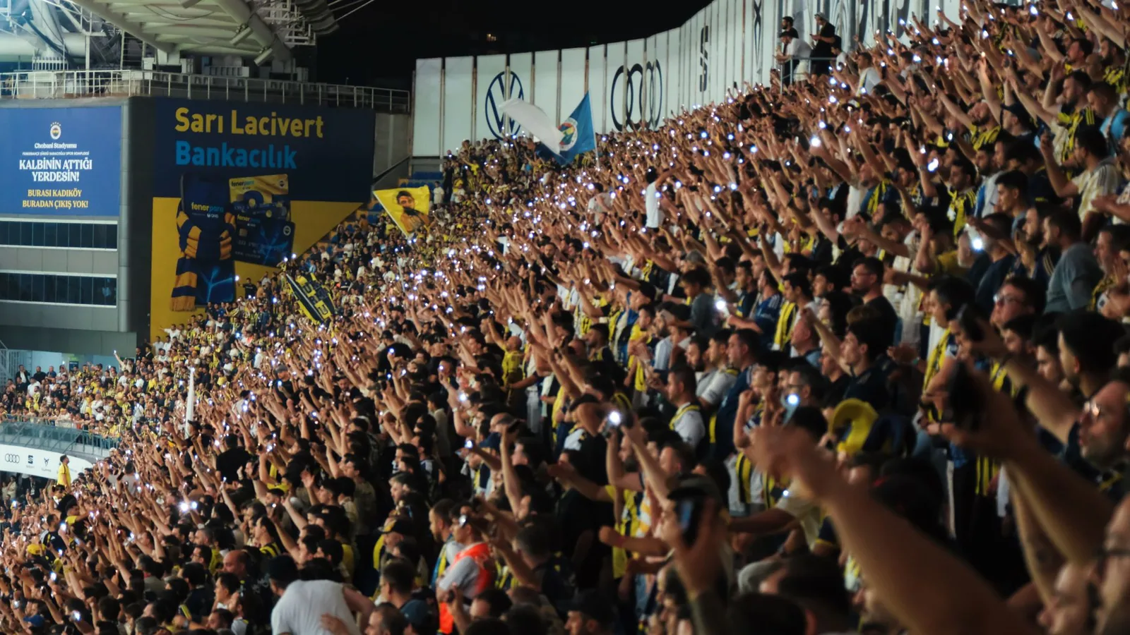 Football fans at a Turkish stadium at night, where sports betting is legal only through licensed iddaa sites