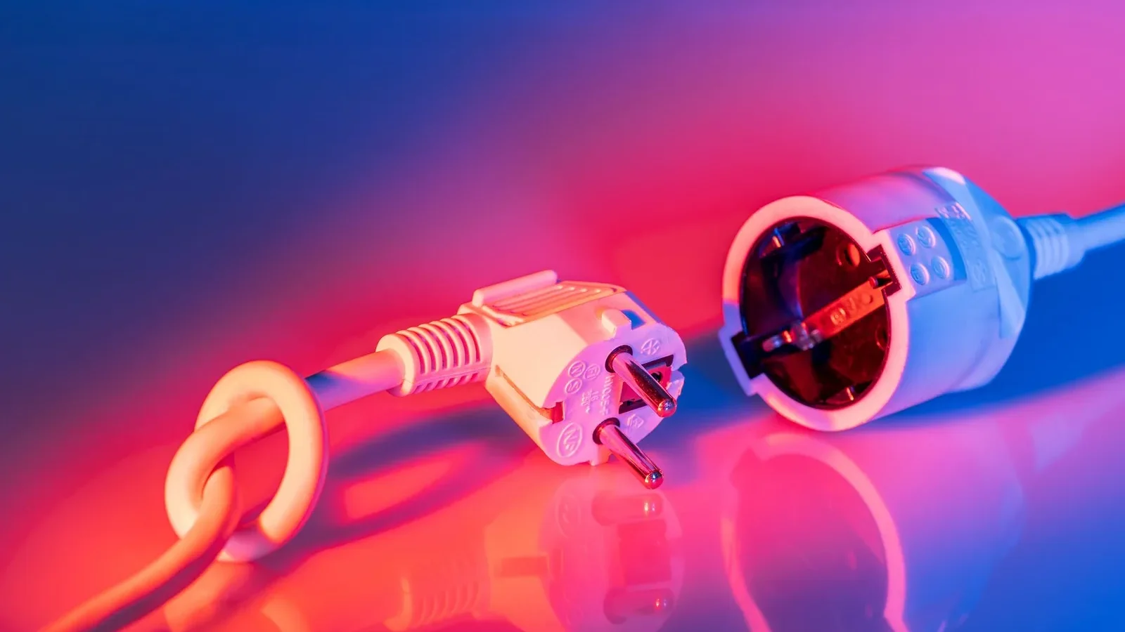 A European Type F plug next to a Type F socket