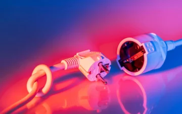 A European Type F plug next to a Type F socket