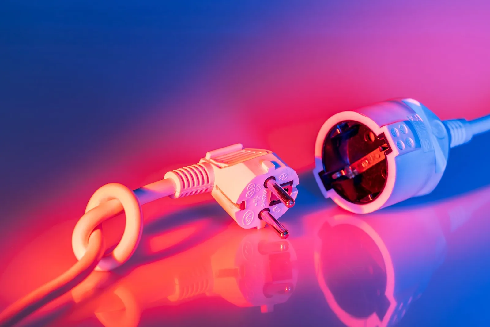 A European Type F plug next to a Type F socket